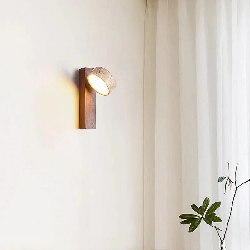 Caldrin wall light with a stone shade and wooden support