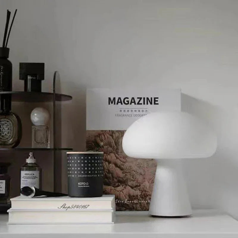 White mushroom-shaped Chaves table lamp on a cabinet