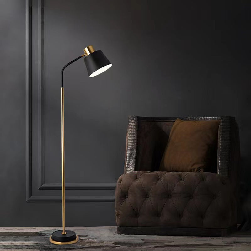 Slim Brass Torchiere Floor Lamp with Tilted Cone Shade and Adjustable Neck | Kelmera