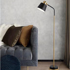 Slim Brass Torchiere Floor Lamp with Tilted Cone Shade and Adjustable Neck | Kelmera