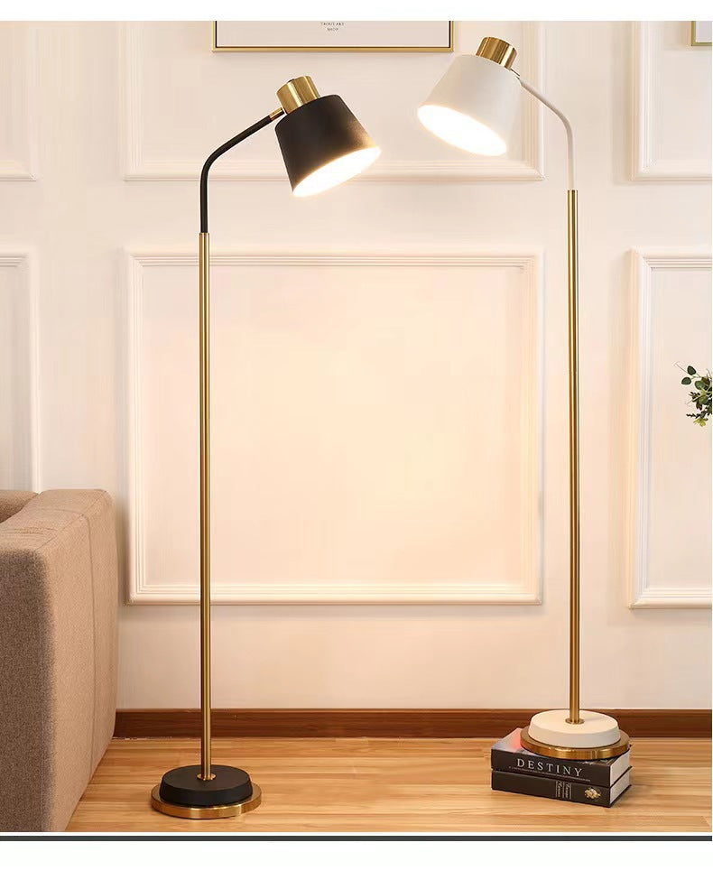 Slim Brass Torchiere Floor Lamp with Tilted Cone Shade and Adjustable Neck | Kelmera